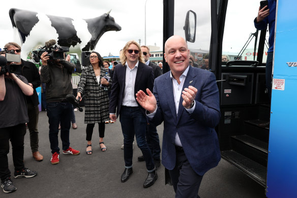 National Party leader Chris Luxon, right, meets locals on October 13, 2023 in Morrinsville, New Zealand.